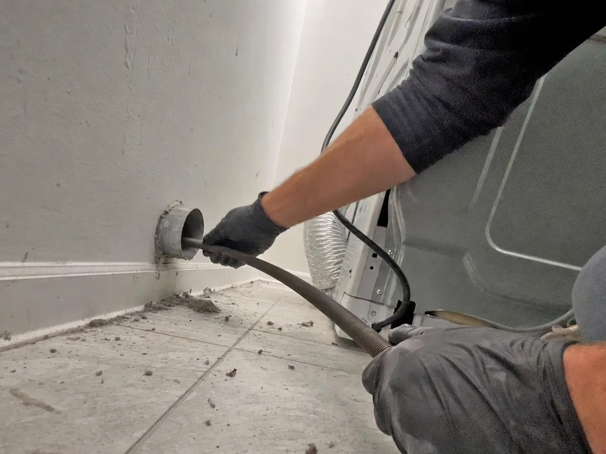 dryer vent cleaning technician on the job in Campbell, CA